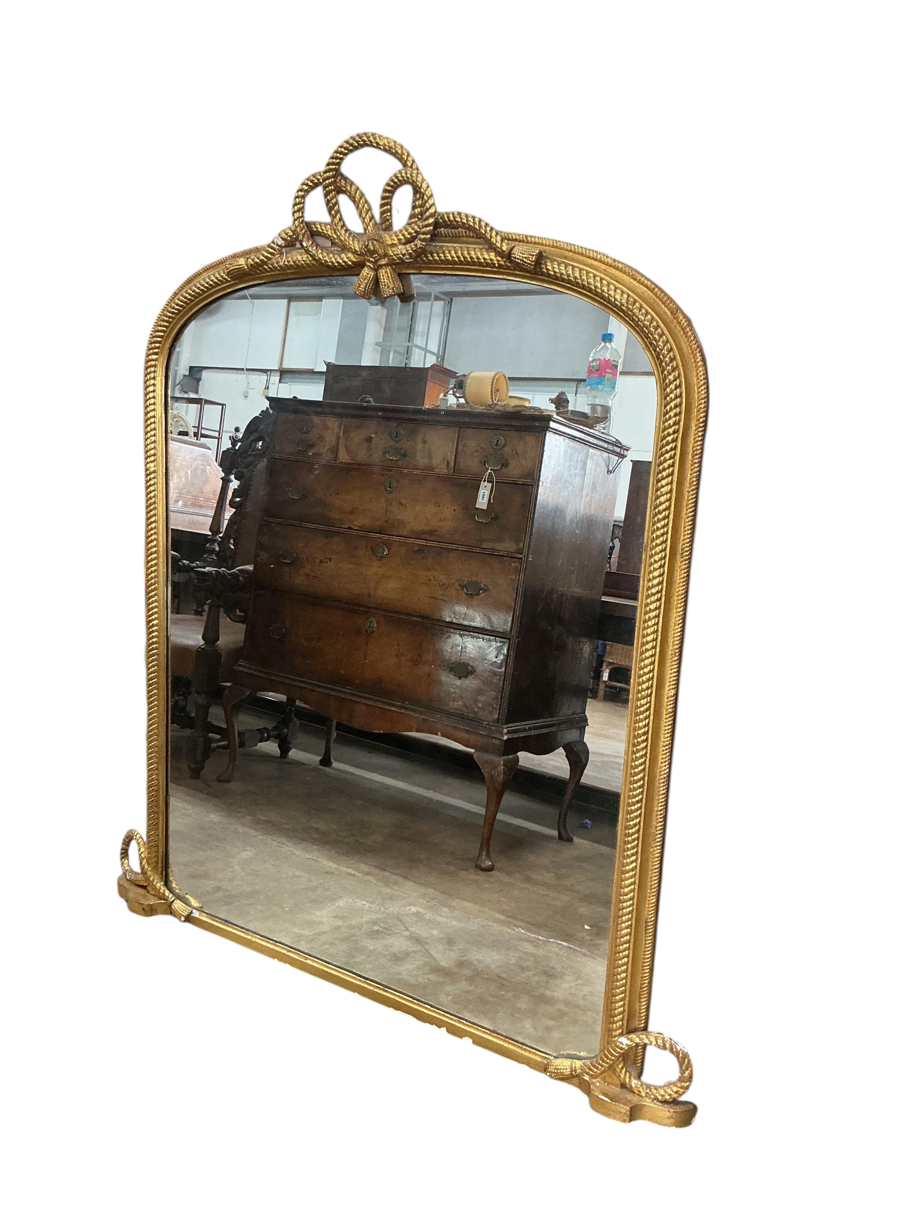 A Victorian giltwood and composition overmantel mirror with tied rope twist pediment, width 124cm, height 144cm